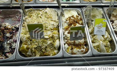 Part of an ice cream counter of an Italian ice cream shop 97387409