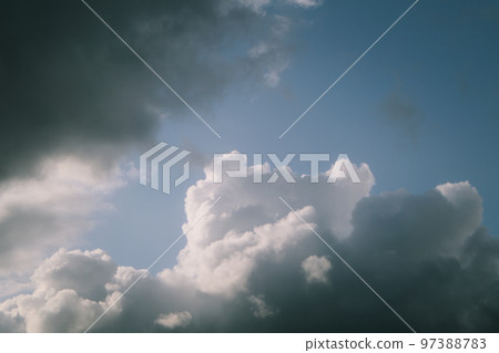 White, fluffy clouds in blue sky. Background from cumulus clouds. Scenery above the clouds White, fluffy clouds in blue sky. Background from cumulus clouds. Scenery above the clouds 97388783