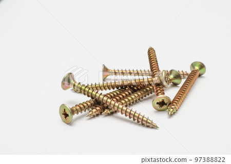 A bunch of yellow screws on a white background. yellow construction screws on white, side view, place for text, copy space. 97388822