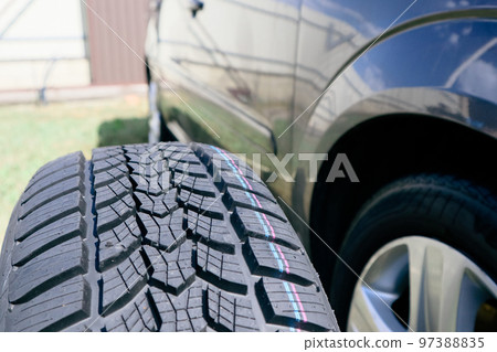 Car winter tire texture plan. tread pattern. rubber wheels for winter. Closeup of car tires Car winter tire texture plan. tread pattern. rubber wheels for winter. Closeup of car tires 97388835
