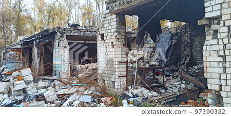 Destruction of buildings after being hit by artillery shell. Russian invasion 97390382