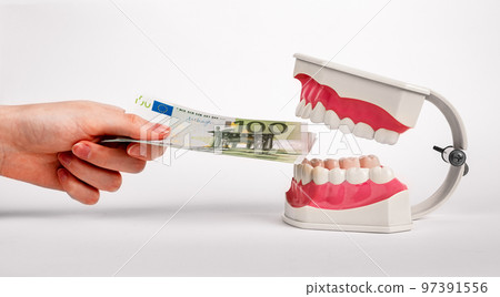 Money for teeth health, tooth healthcare, dental treatment, dentistry service in Euro. High quality photo Money for teeth health, tooth healthcare, dental treatment, dentistry service in Euro. High quality photo 97391556