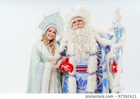 a traditional Father Frost and Snow Maiden costume on a white background. a traditional Father Frost and Snow Maiden costume on a white background. 97392421