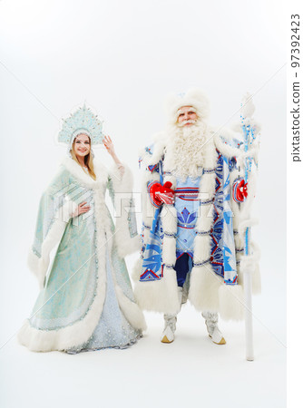 a traditional Father Frost and Snow Maiden costume on a white background. a traditional Father Frost and Snow Maiden costume on a white background. 97392423