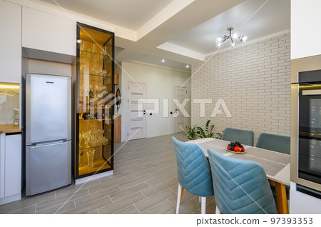 A minimalist white studio with a kitchen A minimalist white studio with a kitchen 97393353