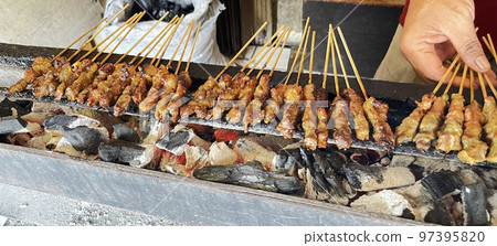 very flavorful beef satay meat grilled over charcoal, beef skewer delicious barbeque, sate sapi 97395820