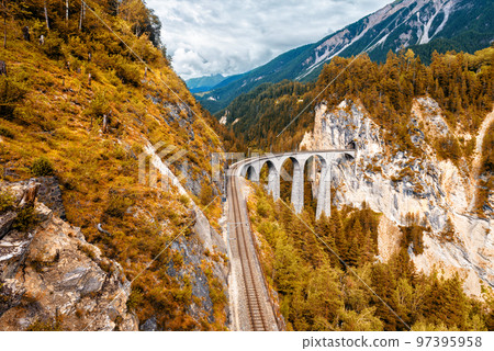 Landwasser Viaduct in autumn, Switzerland. Scenic view of railway in mountains 97395958