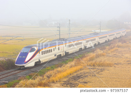 Yamagata Shinkansen E3 Series Shinkansen train running in fog Yamagata Shinkansen E3 Series Shinkansen train running in fog 97397537
