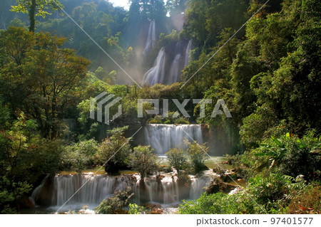 beautiful waterfall in green forest beautiful waterfall in green forest 97401577