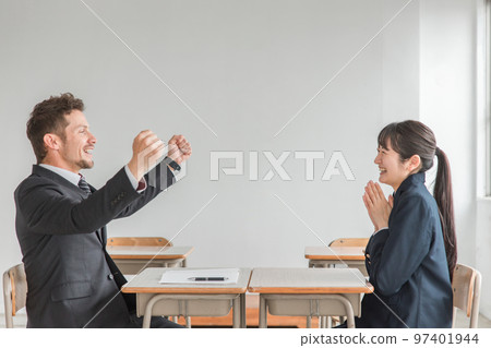 Western teachers and instructors praising students who have passed exams and improved their grades (two-way interviews, career guidance) 97401944