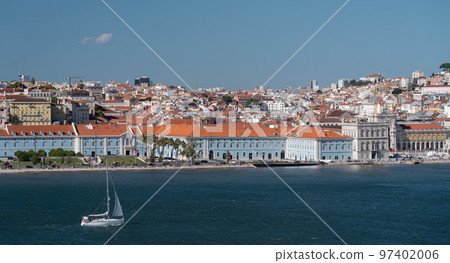 Sailboat on Lisboa Tagus River, waterfront and cityscape. Vacation, leisure, travel concept. Sailboat on Lisboa Tagus River, waterfront and cityscape. Vacation, leisure, travel concept. 97402006