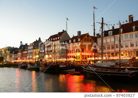 Beautiful night view of Nyhavn in Copenhagen, the capital of Denmark Beautiful night view of Nyhavn in Copenhagen, the capital of Denmark 97403927
