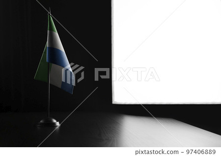 Small national flag of the Sierra Leone on a black background 97406889