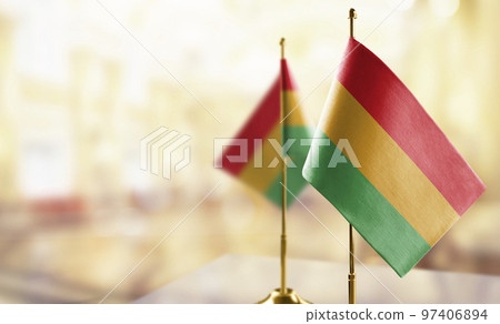 Small flags of the Bolivia on an abstract blurry background 97406894