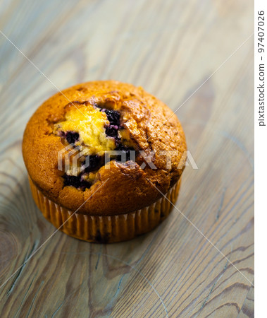 Blueberry muffin on rustic wooden background Blueberry muffin on rustic wooden background 97407026