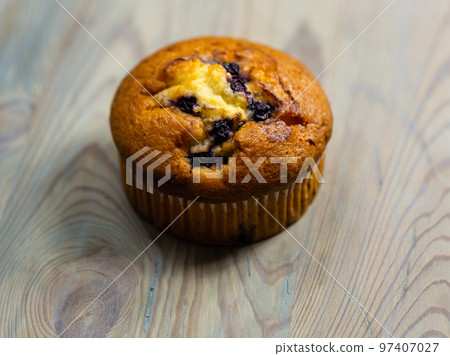 Blueberry muffin on rustic wooden background Blueberry muffin on rustic wooden background 97407027