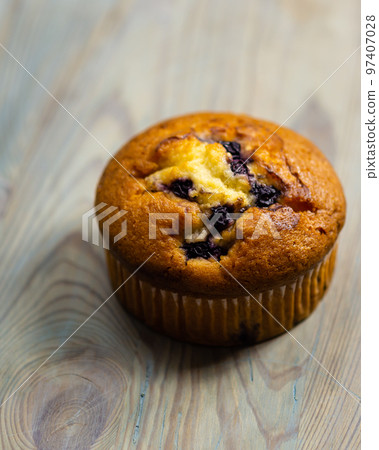 Blueberry muffin on rustic wooden background 97407028