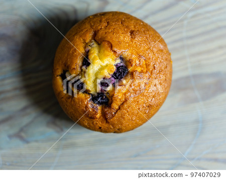Blueberry muffin on rustic wooden background Blueberry muffin on rustic wooden background 97407029