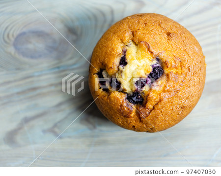 Blueberry muffin on rustic wooden background 97407030