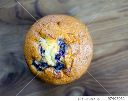 Blueberry muffin on rustic wooden background Blueberry muffin on rustic wooden background 97407031
