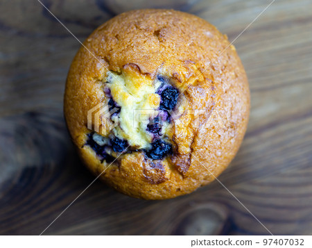 Blueberry muffin on rustic wooden background Blueberry muffin on rustic wooden background 97407032