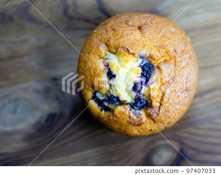 Blueberry muffin on rustic wooden background Blueberry muffin on rustic wooden background 97407033