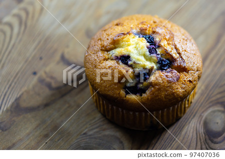 Blueberry muffin on rustic wooden background 97407036