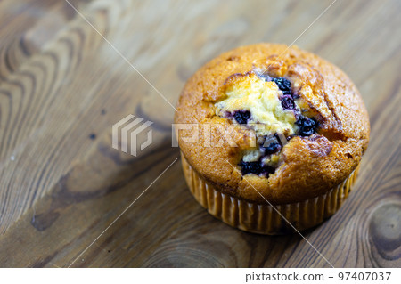 Blueberry muffin on rustic wooden background 97407037