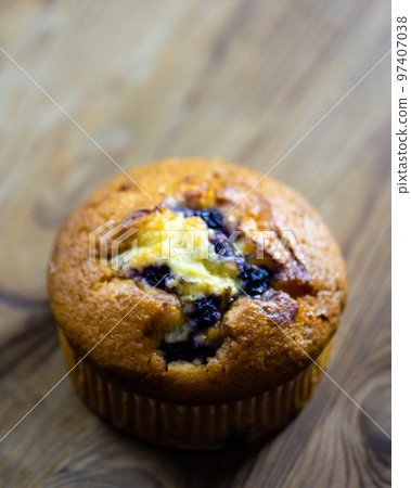 Blueberry muffin on rustic wooden background Blueberry muffin on rustic wooden background 97407038