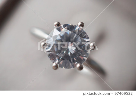 Diamond ring in jewelry gift box close up background Diamond ring in jewelry gift box close up background 97409522