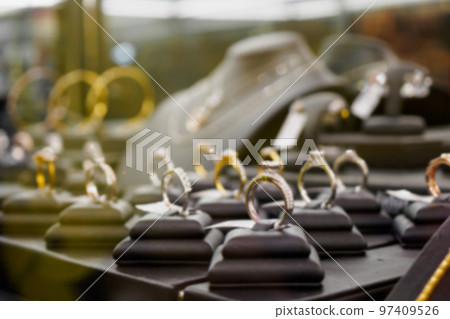Jewelry diamond rings and necklaces show in luxury retail store window display Jewelry diamond rings and necklaces show in luxury retail store window display 97409526