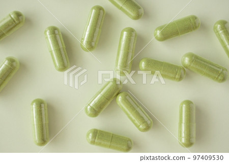 Herbal medicine capsules on white background Herbal medicine capsules on white background 97409530