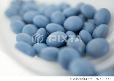 blue medicine pills with bottle on white background blue medicine pills with bottle on white background 97409532