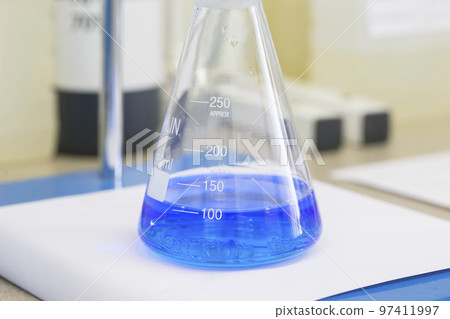 Flask with blue liquid in lab 97411997