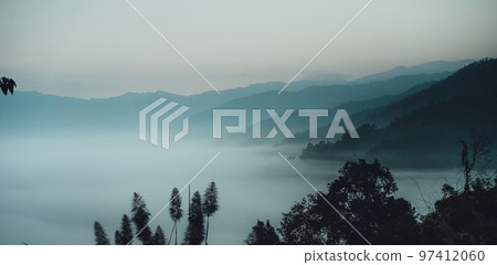 Sunrise in the forest,Aerial view of thick morning fog 97412060