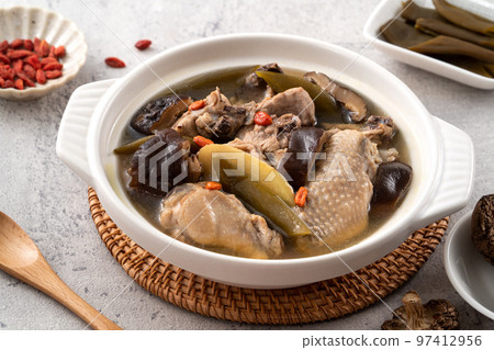 Delicious Taiwanese peeled green chili pepper chicken soup with mushroom and goji berry 97412956