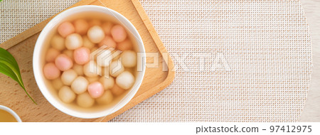 Red and white tangyuan with syrup soup. Red and white tangyuan with syrup soup. 97412975