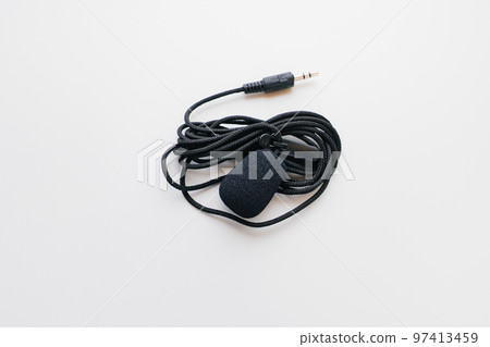 Buttonhole on a white background. Compact microphone for audio recording. Buttonhole on a white background. Compact microphone for audio recording. 97413459