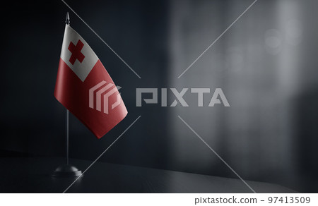 Small national flag of the Tonga on a black background 97413509