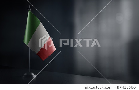 Small national flag of the Italy on a black background 97413590