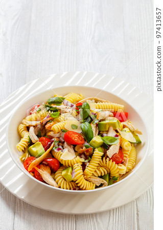 Chicken Pasta Salad with Avocado, Tomato in bowl 97413657