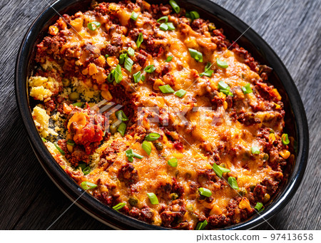 Cajun Beef Cornbread Casserole in baking dish 97413658