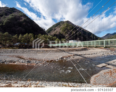 Yamabiko Bridge over the Tanba River in Tambayama Village, Yamanashi Prefecture, in sunny winter 97416507