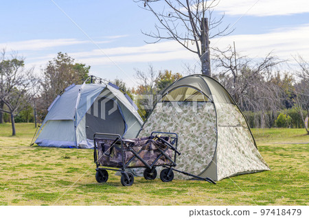 Pitch a tent in the park and relax 97418479