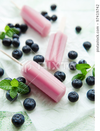 Homemade blueberry ice cream or popsicles 97419742