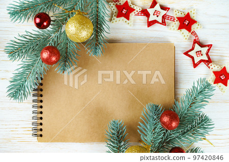 Blank notebook with christmas decoration. top view. Blank notebook with christmas decoration. top view. 97420846