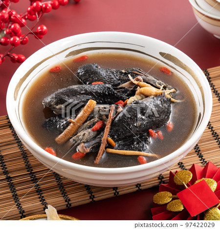 Delicious silky chicken soup with Chinese herbal medicine Delicious silky chicken soup with Chinese herbal medicine 97422029