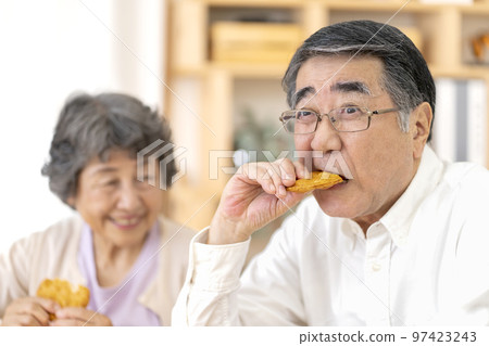 Senior man who has difficulty eating hard food Senior man who has difficulty eating hard food 97423243