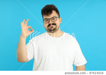 Concept of people, young fat man on blue background 97423816