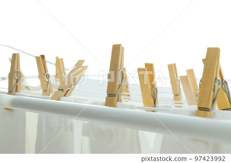 Drying rack with socks and clothes, isolated on white background Drying rack with socks and clothes, isolated on white background 97423992